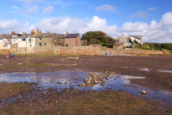 Villages houses at the edge of the beach in Ravenglass, Lake District, Cumbria
